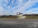 Two story house with a long driveway and wooden fence at 1145 Philbeck Rd # 11, York, SC 29745