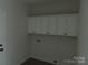 Laundry room with white cabinets at 1145 Philbeck Rd # 11, York, SC 29745