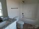 Clean bathroom with a tub, toilet and granite countertop at 1187 Philbeck Rd # 13, York, SC 29745