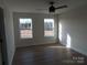 Spacious bedroom with hardwood floors and two large windows at 1187 Philbeck Rd # 13, York, SC 29745