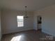 Spacious dining room featuring hardwood floors and a chandelier at 1187 Philbeck Rd # 13, York, SC 29745