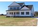 Two-story farmhouse with white siding, black accents, and a front porch at 1187 Philbeck Rd # 13, York, SC 29745