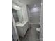 Bathroom with tub, vanity, and grey tile flooring at 5033 Falstone Dr, Charlotte, NC 28269