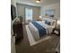 Bright bedroom featuring a king-size bed and stylish decor at 5033 Falstone Dr, Charlotte, NC 28269