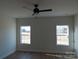 Bedroom with two windows and ceiling fan at 1169 Philbeck Rd # 12, York, SC 29745