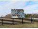 Two-story house with blue siding, white trim, and a black fence at 1169 Philbeck Rd # 12, York, SC 29745