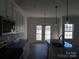 Kitchen with granite countertops and French doors leading to deck at 1169 Philbeck Rd # 12, York, SC 29745