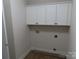 Laundry room with white cabinets and vinyl flooring at 1169 Philbeck Rd # 12, York, SC 29745