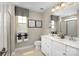 Modern bathroom with double vanity, and a large walk-in shower at 452 Moondance Dr, Gastonia, NC 28054