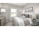 Bright bedroom with a queen-size bed and neutral decor at 452 Moondance Dr, Gastonia, NC 28054