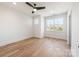 Bright bedroom with hardwood floors, natural light, ceiling fan, and neutral walls at 3945 Plainview Rd, Charlotte, NC 28208