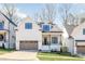 Charming two-story home featuring a modern design, white siding, and a two-car garage with attractive landscaping at 3945 Plainview Rd, Charlotte, NC 28208