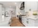 Well-appointed kitchen featuring stainless steel appliances, quartz countertops and modern white cabinets at 3945 Plainview Rd, Charlotte, NC 28208