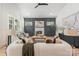 Elegant living room featuring a decorative fireplace, modern furnishings, and ample natural light, creating a cozy ambiance at 3945 Plainview Rd, Charlotte, NC 28208