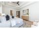 Bright main bedroom showcasing a tray ceiling, natural light, modern furnishings, and soothing colors at 3945 Plainview Rd, Charlotte, NC 28208