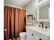 Bathroom featuring a white sink, vanity, and brown shower curtain at 5535 Whispering Wind Ln, Indian Trail, NC 28079