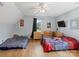 Bedroom with hardwood floors, ceiling fan, a window, and lots of light at 5535 Whispering Wind Ln, Indian Trail, NC 28079