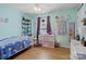 Bedroom featuring hardwood floors, ceiling fan, one window and blue colored walls at 5535 Whispering Wind Ln, Indian Trail, NC 28079