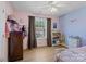 Bedroom with hardwood flooring, ceiling fan and window providing natural light at 5535 Whispering Wind Ln, Indian Trail, NC 28079
