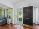 Inviting entryway features hardwood floors and the front door, which shows views of the home's exterior at 5535 Whispering Wind Ln, Indian Trail, NC 28079
