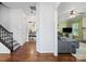 Hallway with hardwood floors leads to a living room and dining area at 5535 Whispering Wind Ln, Indian Trail, NC 28079
