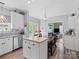 Bright eat-in kitchen with an island, stainless steel appliances and view to the Living Room and backyard at 5535 Whispering Wind Ln, Indian Trail, NC 28079