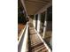 Private balcony with wooden deck and white railings at 1645 Arlyn Cir # J, Charlotte, NC 28213