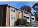 Brick and beige two-story building with balconies at 1645 Arlyn Cir # J, Charlotte, NC 28213