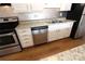 Stainless steel dishwasher and white cabinets in this kitchen at 1645 Arlyn Cir # J, Charlotte, NC 28213