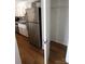 Stainless steel refrigerator in kitchen with pantry at 1645 Arlyn Cir # J, Charlotte, NC 28213