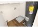 Functional laundry room with washer and dryer hookups, and water heater at 1645 Arlyn Cir # J, Charlotte, NC 28213