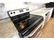 Black electric stovetop in a modern kitchen at 1645 Arlyn Cir # J, Charlotte, NC 28213