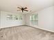 Spacious bedroom with multiple windows and ceiling fan at 17810 Half Moon Ln # Q, Cornelius, NC 28031