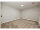 Simple bedroom with carpet flooring and neutral walls at 17810 Half Moon Ln # Q, Cornelius, NC 28031