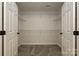 Walk-in closet with wire shelving at 17810 Half Moon Ln # Q, Cornelius, NC 28031