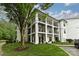 Two-story condo building with white exterior and balconies at 17810 Half Moon Ln # Q, Cornelius, NC 28031