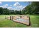 Community garden with raised beds and a volleyball court at 17810 Half Moon Ln # Q, Cornelius, NC 28031