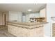 Kitchen boasts granite countertops and an island with a brick-like facade at 17810 Half Moon Ln # Q, Cornelius, NC 28031