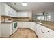 Kitchen with white cabinets and granite countertops at 17810 Half Moon Ln # Q, Cornelius, NC 28031