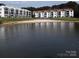 Lakefront property with sandy beach and condo buildings at 17810 Half Moon Ln # Q, Cornelius, NC 28031