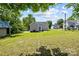 Large grassy backyard with shed and trees at 37 Knox St, Salisbury, NC 28144