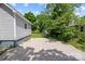 Gravel parking area and partially fenced backyard at 37 Knox St, Salisbury, NC 28144