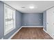 Simple basement bedroom with wood floors and a large window at 37 Knox St, Salisbury, NC 28144