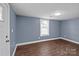 Spacious basement bedroom with wood floors and a window at 37 Knox St, Salisbury, NC 28144