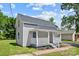 Newly renovated house with gray siding, white porch, and landscaped yard at 37 Knox St, Salisbury, NC 28144