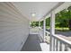 Inviting front porch with white railings overlooking the street at 37 Knox St, Salisbury, NC 28144