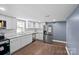 Modern kitchen with white cabinets and granite countertops at 37 Knox St, Salisbury, NC 28144