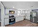 Modern kitchen with white cabinets and granite countertops at 37 Knox St, Salisbury, NC 28144