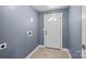 Laundry area with tile floor and exterior access at 37 Knox St, Salisbury, NC 28144