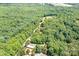 Aerial view of wooded acreage showcasing potential building sites at 4658 Sugar Plum Ln, Davidson, NC 28036